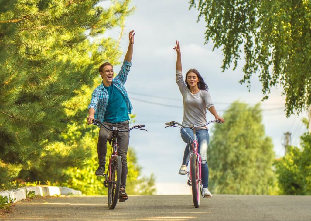 the-smile-couple-riding-a-bike-and-gesture-outdoor-2024-11-25-23-54-18-utc (1)